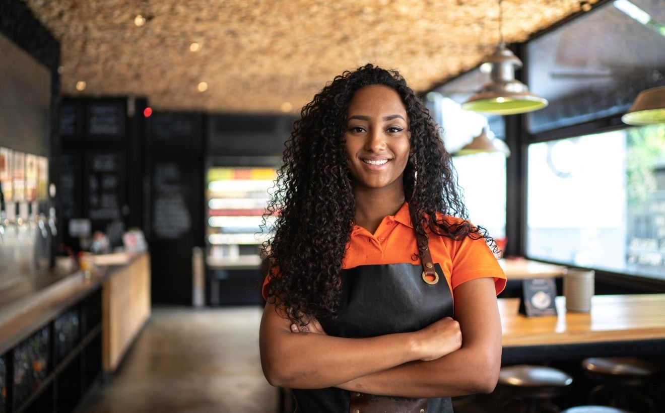 Restaurant operator standing in a cafe